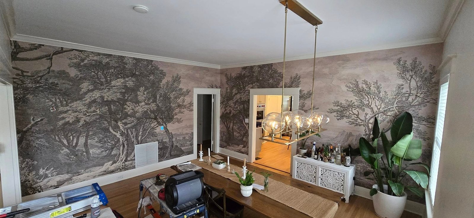 Elegant wallpapered interior with a professionally installed mural